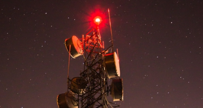 Cell tower with red obstruction light.