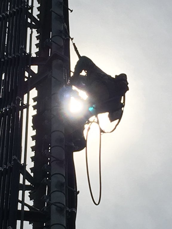 Tower technician conducting cell tower maintenance. 